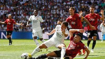 Real Madrid attacker Eden Hazard is challenged by Rodrigo Battaglia of Mallocra. Reuters