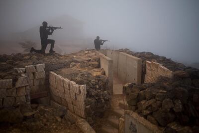 Metal boards in the shape of gunmen sit on Mount Bental in the Israeli controlled Golan Heights, in 2014. AP