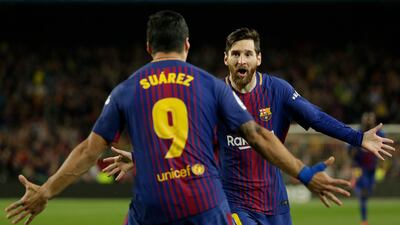 Former Barcelona players Lionel Messi and Luis Suarez. Both Real Madrid and FC Barcelona oppose the CVC private equity deal. AP