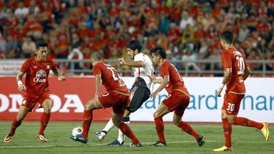 Luis Suarez, in white, is expected to go all out against Manchester United on Wednesday. Stanley Chou / Getty Images