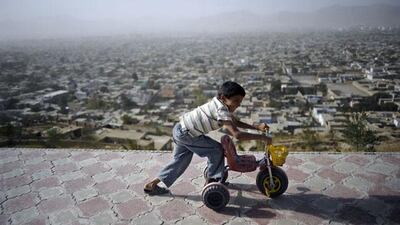 An Afghan child plays on top of Wazir Akbar Khan Hill in Kabul. Jose Cabezas / AFP Photo
