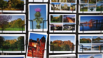 Postcards are displayed outside a shop along the Royal Mile in Edinburgh, Scotland. The contrast between the capital and Kilmarnock is startling and highlights the wide social divide among Scots ahead of a September 18 referendum when Scottish residents will decide whether to leave the United Kingdom after more than 300 years to become an independent country. Suzanne Plunkett / Reuters