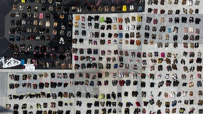 A sign reads "4645" near empty shoes outside the Capitol building in this aerial photograph taken during a protest against the government's reporting of the death toll from Hurricane Maria in San Juan, Puerto Rico. Xavier Garcia / Bloomberg