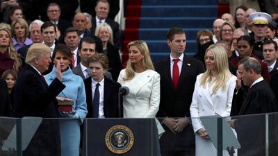 U.S. President Donald Trump takes the oath of office from U.S. Supreme Court Chief Justice John Roberts with his wife Melania, and children Barron, Donald, Ivanka and Tiffany at his side during inauguration ceremonies at the Capitol in Washington, U.S., January 20, 2017. Reuters