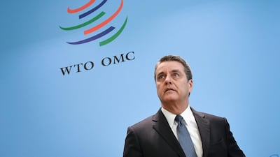 World Trade Organization director-general Roberto Azevedo looks on under the agency's sign at their headquarters in Geneva. AFP