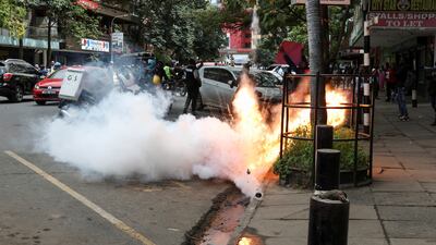 Riot police throw tear gas at demonstrators during a protest over the death of Kenyan blogger Albert Ojwang in police custody, in downtown Nairobi. Reuters