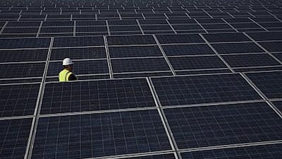 Photovoltaic panels convert sunlight into electricity at Masdar's 10MW power plant outside Abu Dhabi.