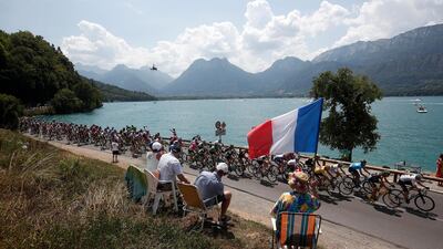 Cyclists in action next to Annecy Lake during the 10th stage of the Tour de France over 158,5km between Annecy and Le Grand-Bornand. Yoan Valat / EPA