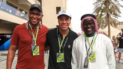 Antonio Silva, Adrian Lee-chin and Rogers Sithole on championship day behind the Pit Lane Walk at the Yas Marina Circuit in Abu Dhabi. Victor Besa / The National