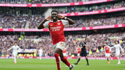 Arsenal's Bukayo Saka celebrates after scoring his side's second goal. PA