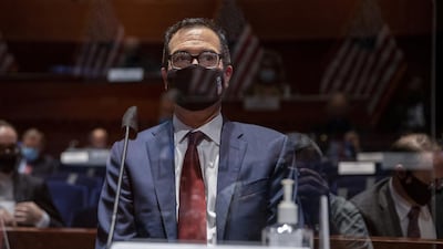 US Treasury Secretary Steven Mnuchin, wearing a face mask, prepares to testify before the House of Representatives Financial Services Committee in Washington this week. Reuters