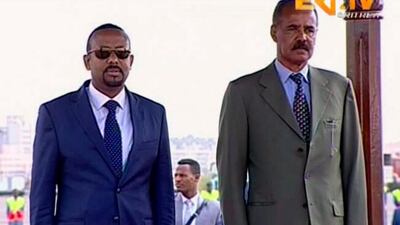A screengrab from Eritrean TV shows Ethiopian Prime Minister Abiy Ahmed, left, and Eritrean President Isaias Afwerki reviewing a guard of honour in Asmara, Eritrea, on July 8, 2018. ERITV via AP