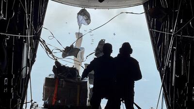 Members of the Jordanian Armed Forces drop aid parcels along the Gaza coast, in co-operation with Egypt, Qatar and France. Reuters