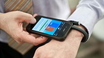 Jawbone in 2012 released redesigned fitness devices such as its UP wristband but still went into liquidation. Nicholas Kamm / AFP