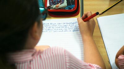 A student hard at work during a literacy class. Lee Hoagland / The National