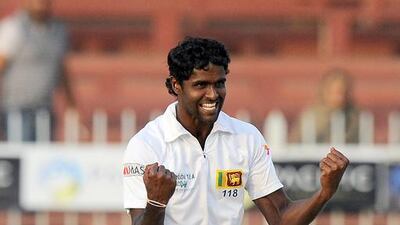 Sri Lankan bowler Shaminda Eranga celebrates the dismissal of Pakistani batsman Asad Shafiq on Saturday during third day of the third Test in Sharjah. Ishara S Kodikara / AFP
