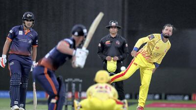 Team Abu Dhabi's Rohan Mustafa bowls against Maratha Arabians in the Abu Dhabi T10 league at the Zayed Cricket Stadium. Chris Whiteoak / The National