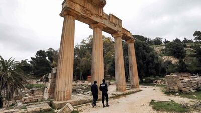 Policemen patrol by a colonnade from the remnants of the Temple of Demeter in the ruins of Libya's ancient eastern city of Cyrene. AFP