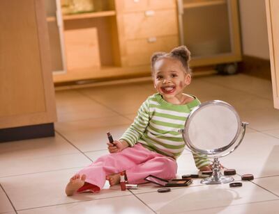 Applying make-up while playing dress-up is different than when young girls seek it out because they are influenced by unrealistic beauty standards. Getty