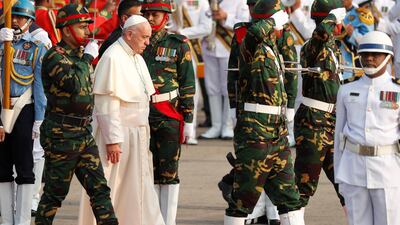 Pope Francis inspects a honour guard. Damir Sagolj / Reuters
