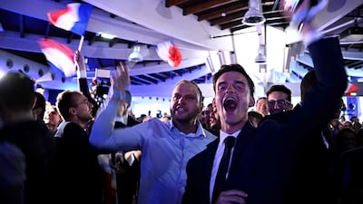 National Rally members celebrate after French President Emmanuel Macron announced a general election, with voting starting on June 30. AFP