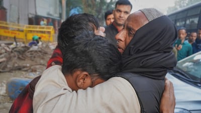 Families mourn those killed in a car explosion near the historic Red Fort in New Delhi. AP