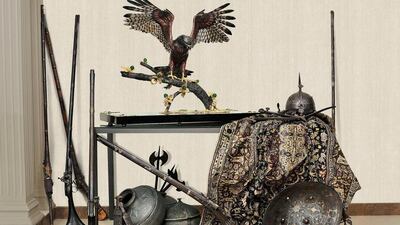 Falcon on Branch: a silver and copper falcon in a hand-tarnished finish with a sterling silver beak and feet in 18K yellow-gold plating. The falcon is perched on a bronze branch with copper leaves in 18K yellow-gold plating with green quartz flowers, all on a black hand-lacquered wooden base, with sculpted resin covered with 24K gold leaf, and decorative angles set with rubies and quartz. Courtesy Prologue