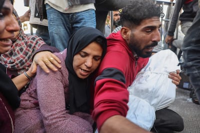 Relatives mourn as they carry the bodies of Palestinian children Nayef and Abdallah Nashwan, who were killed in Israeli bombardment of Al Zawaydeh village in the central Gaza Strip. AFP