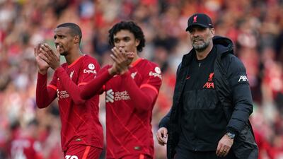Jurgen Klopp, Trent Alexander-Arnold and Joel Matip celebrate after the match. AP