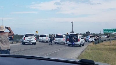 Police cars are seen at Sutherland Springs where a church shooting is reported to have taken place. Liz Summers/via REUTERS