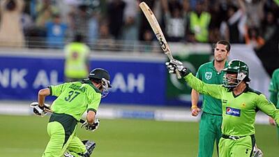 Zulqarnain Haider, left, and Shoaib Akhtar celebrate their win over South Africa in Dubai last night.