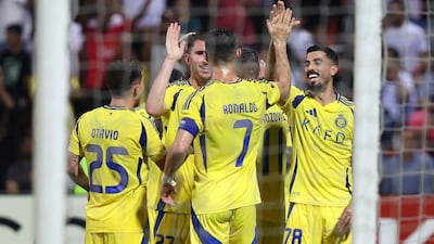 Aymeric Laporte celebrates with Ronaldo and his Al Nassr teammates after scoring the only goal of the game. Chris Whiteoak / The National