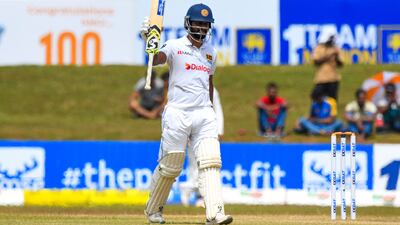 Sri Lanka captain Dimuth Karunaratne celebrates reaching his half-century. AFP