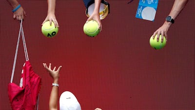 Ashleigh Barty signs autographs after winning her match at the Australian Open in Melbourne. Reuters