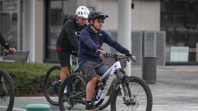 Cyclists in central Abu Dhabi during the showers.