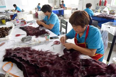 The methods behind sourcing human hair can be unethical, so look for trusted brands that strive to give back to the workers and community. AFP