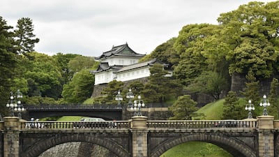 A motorcade (C) carrying Japan's new Emperor Naruhito crosses a bridge as he leaves the grounds of the Imperial Palace in Tokyo. Japan's new Emperor Naruhito formally ascended the Chrysanthemum Throne on May 1, a day after his father abdicated from the world's oldest monarchy and ushered in a new imperial era. AFP