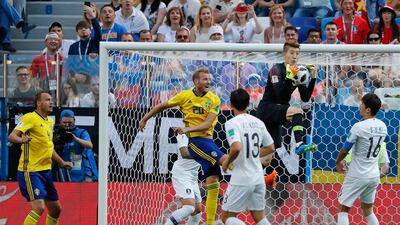 South Korea goalkeeper Jo Hyun-woo claims the ball. Pavel Golovkin / AP Photo