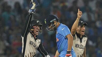 Cricket - New Zealand v India - World Twenty20 cricket tournament - Nagpur, India, 15/03/2016. New Zealand's wicketkeeper Luke Ronchi (L) and Ross Taylor (R) celebrate the dismissal of India's Yuvraj Singh. REUTERS/Danish Siddiqui