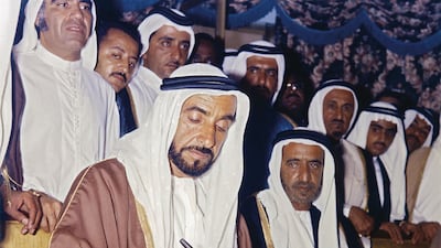 The UAE's Founding Father, the late Sheikh Zayed bin Sultan Al Nahyan, signs the Treaty of Friendship an hour after becoming President of the UAE, in a historic moment captured by the acclaimed Indian photographer. Photo: Ramesh Shukla