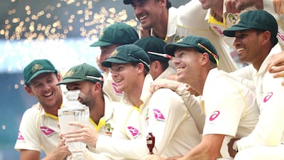 Australia captain Steve Smith lifts the Ashes trophy after another innings victory over England at the Sydney Cricket Ground. Australia regained the Ashes 4-0. Ryan Pierse/Getty Images