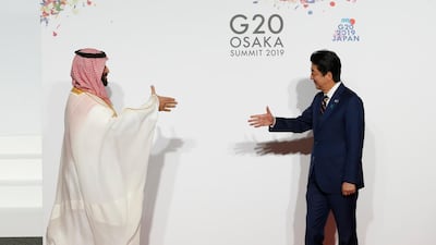 Saudi Arabian Crown Prince Mohammed bin Salman, left, is welcomed by Japanese Prime Minister Shinzo Abe in Osaka at the G20 summit. Kim Kyung-Hoon / pool via Getty
