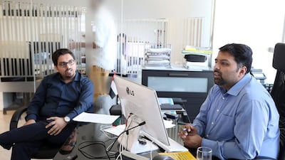 The Rafiq brothers Atif, left, and Kash have been investing in IT infrastructure in their family-owned firm to digitise most activities and provide customers with real-time information over deliveries. Pawan Singh / The National