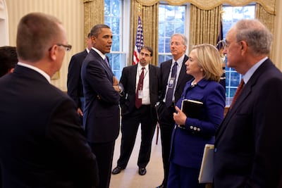 Then-president Barack Obama talks with members of his Middle East policy team including, from right, George Mitchell, special envoy for Middle East peace; secretary of state Hillary Clinton; Dennis Ross, senior director for the Central Region; and Dan Shapiro, senior director for the Middle East on the National Security Council, on September 1, 2010. Photo: White House
