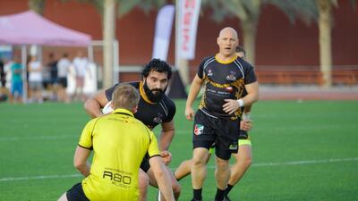 Al Ain Amblers (black) are enjoying their switch to rugby league this season. Victor Besa for The National