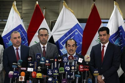 Riyadh al-Badran, the head of Iraq's Independent Higher Election Commission (IHEC), speaks during a press conference, in the presence of the nine members of the IHEC. AFP