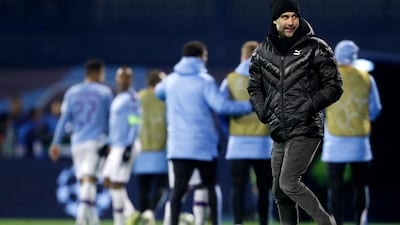 Manchester City coach Pep Guardiola smiles at the end of the Champions League qualifying game. AP