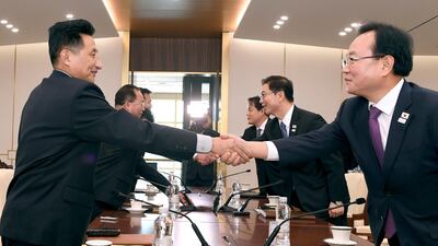 South Korean Vice Unification Minister Chun Hae-sung, center right, shakes hands with the head of North Korean delegation Jon Jong Su during their meeting at Panmunjom in the Demilitarized Zone in Paju, South Korea. AP