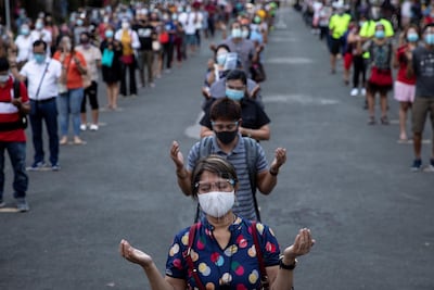 Filipino Catholics maintain social distancing to prevent the spread of the coronavirus disease during Mass on Ash Wednesday in Metro Manila. Reuters