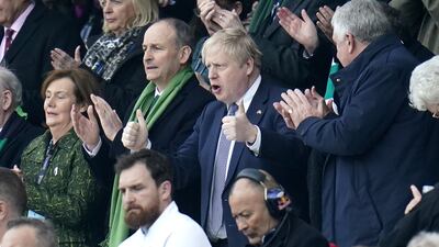 Irish Prime Minister Michael Martin and British Prime Minister Boris Johnson watch a Six Nations rugby match at Twickenham Stadium, London, on Saturday. PA Images